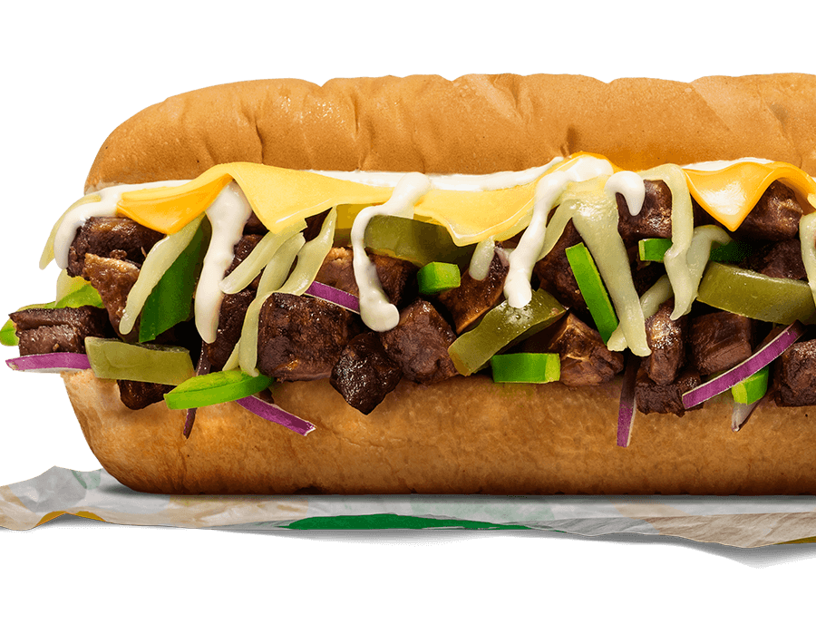 Subway® Philly-Style Three-Cheese Sub with steak, three cheeses, onions, capsicum, jalapeños, and aioli.